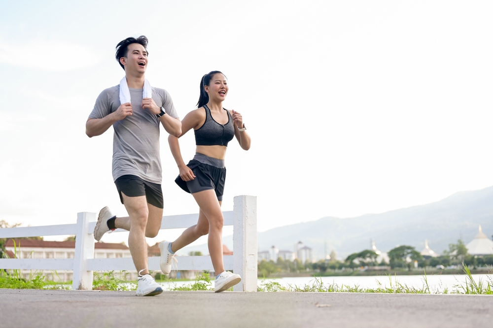 Young man and woman running