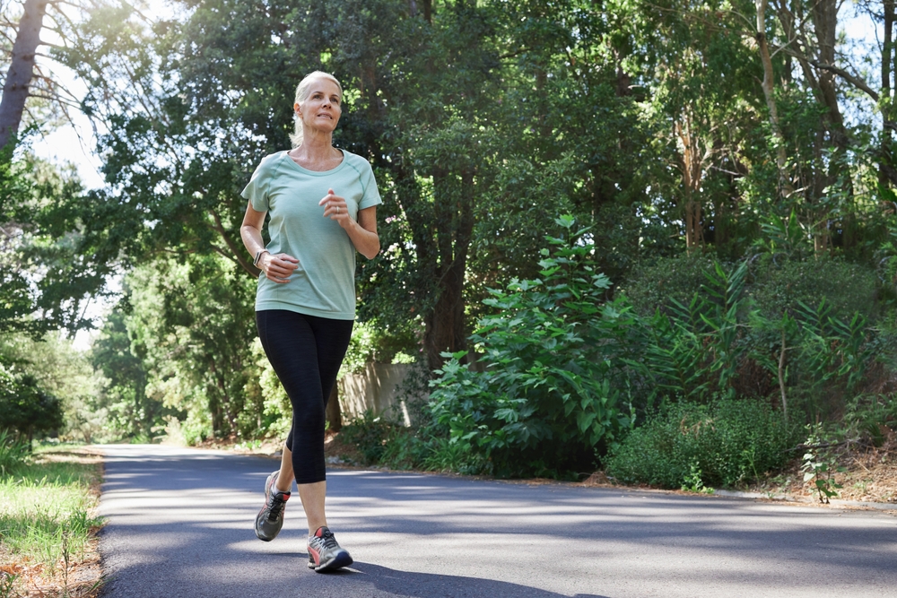 Female in the late fifties running