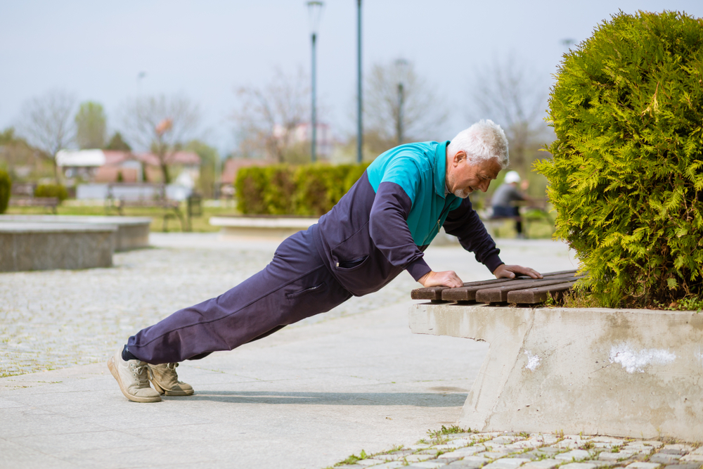 Old male doing push ups