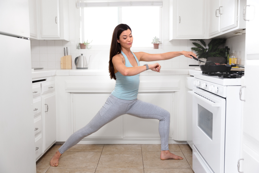 Woman yoga in kitchen