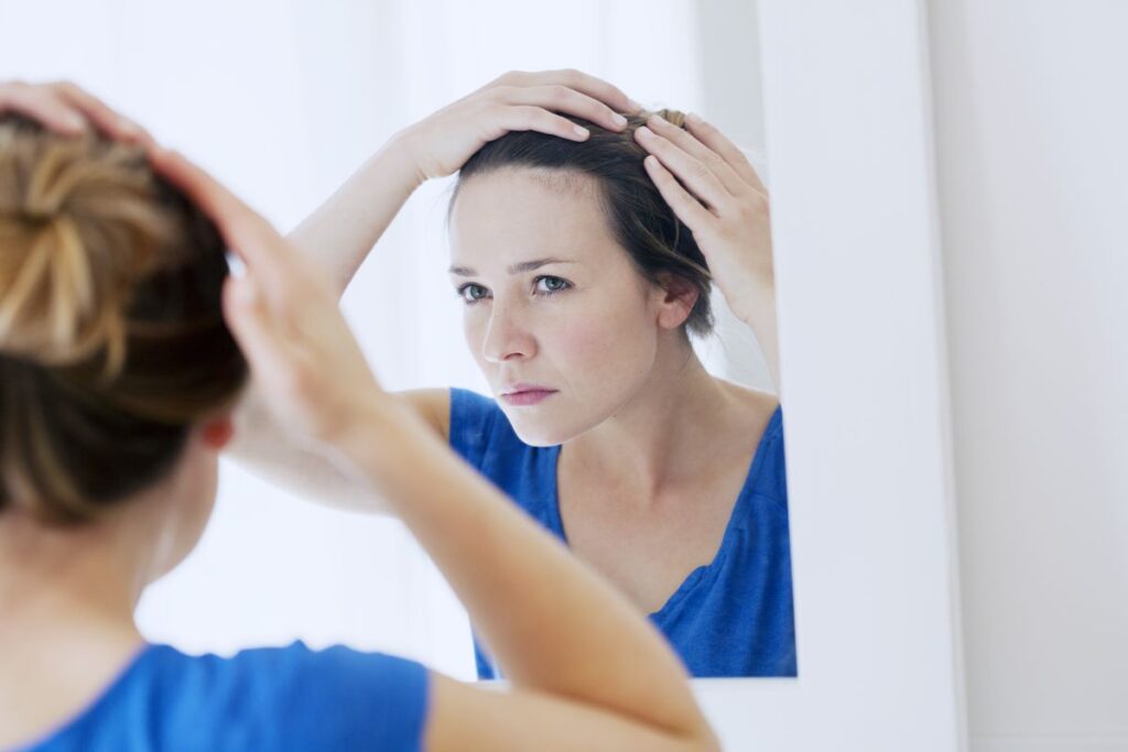 Woman checking her hair